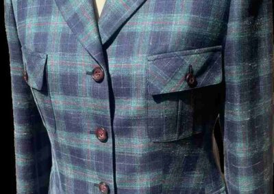 Blue and green plaid jacket with buttons, elegantly displayed in a Chicago, IL