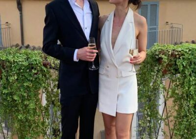 A Couple Stands on a Balcony Showcasing Western Wedding Dress in Chicago, IL